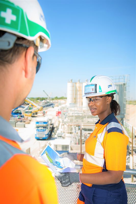 Working with site teams at a construction concrete plant.